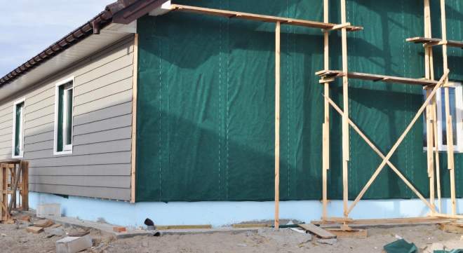 an ongoing siding and windows installation